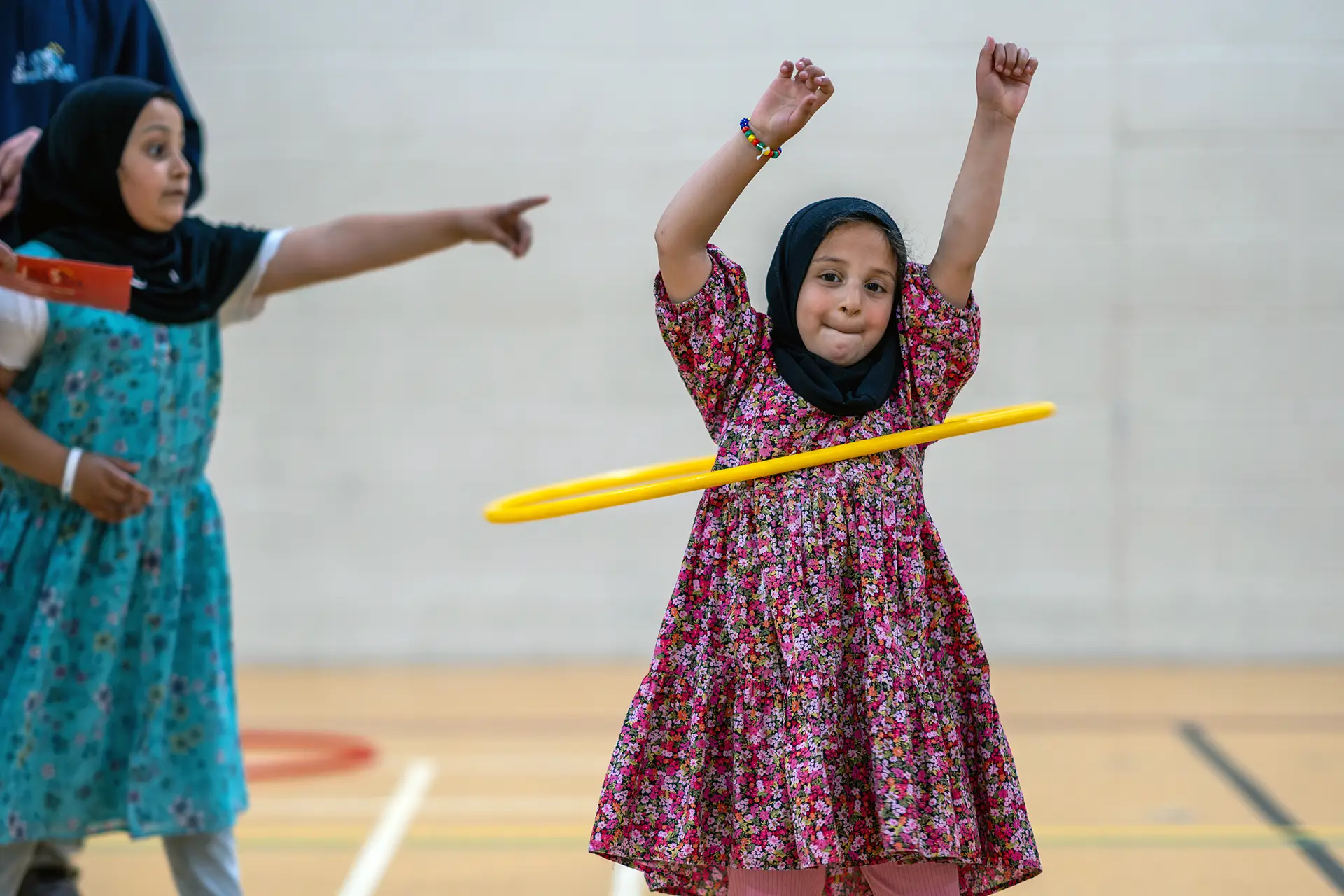 Child playing with hoolahoop