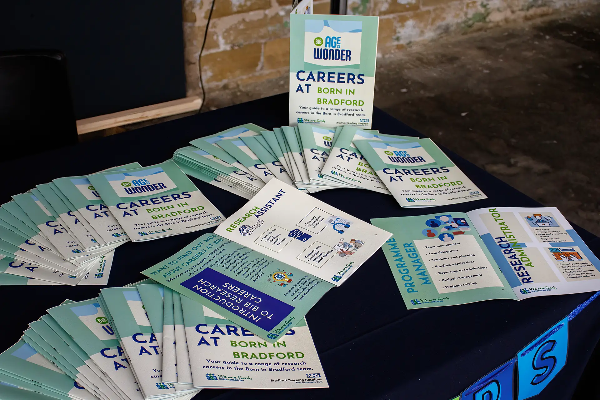 Careers at Born in Bradford leaflets spread across a table