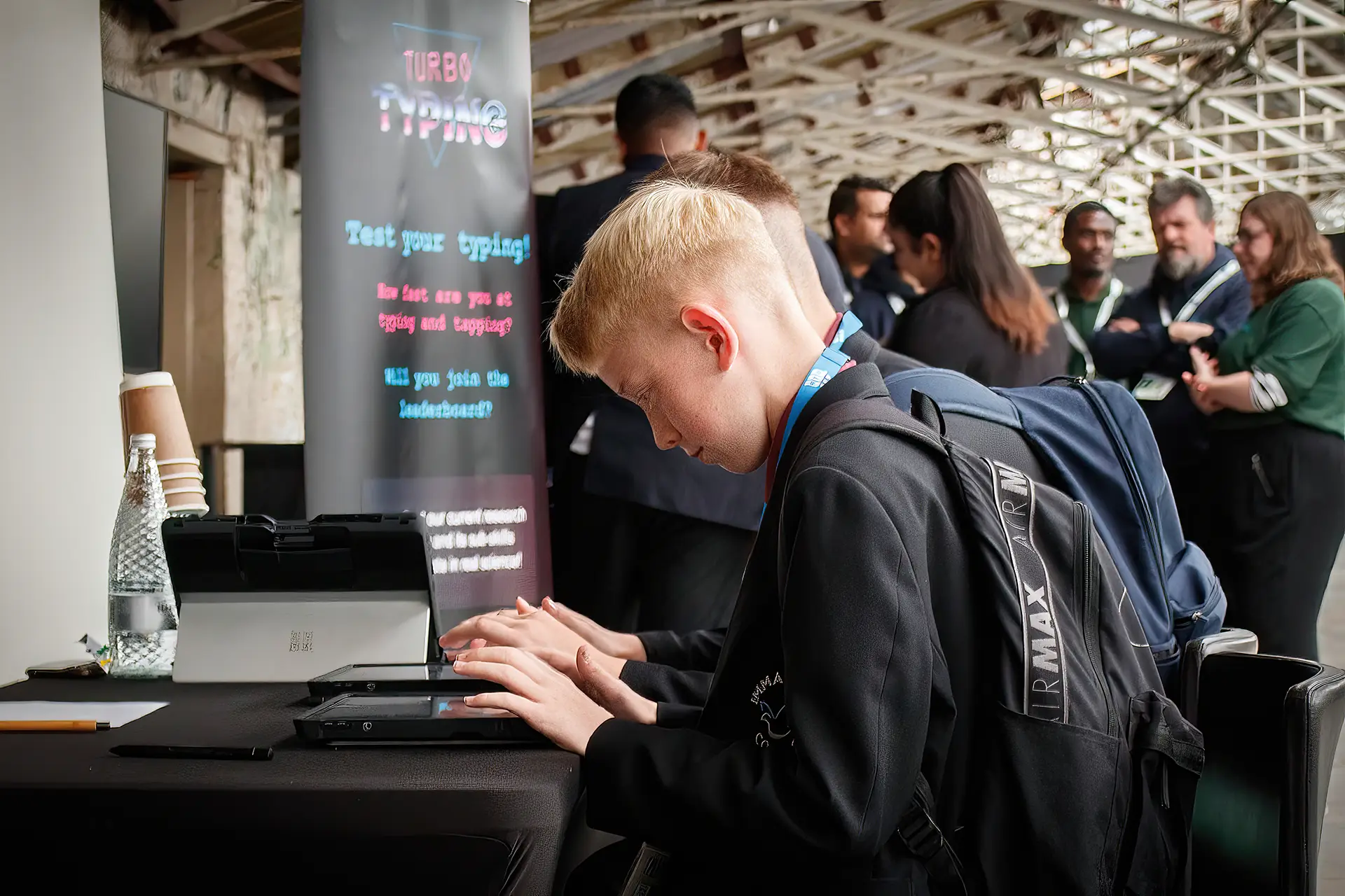 Children with school uniforms completing tasks on a digital tablet