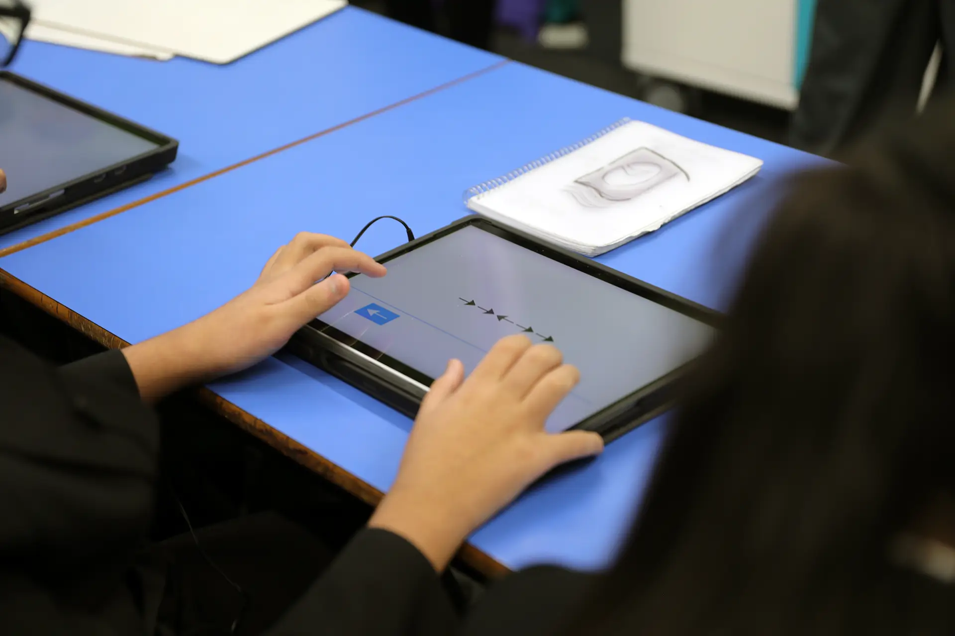 Child working on task on tablet