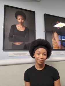 Grace aged 16 with her portrait.